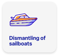 Sailboat dismantling with mast and structural removal.